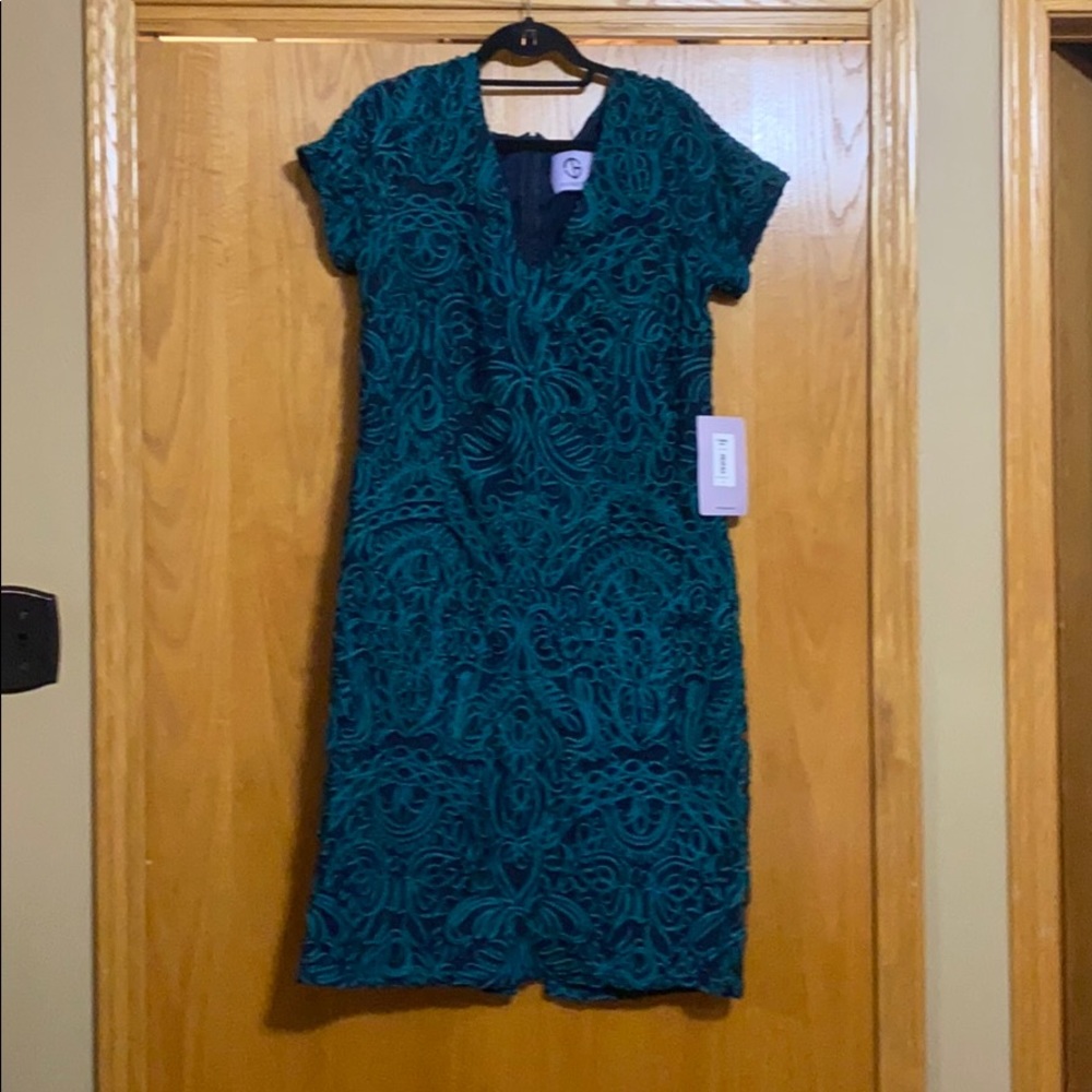 Blue below knee fitted dress with green embroidery